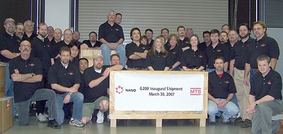 Nano Indenter G200 Inaugural Shipment: March 30, 2007 sign and employees